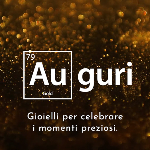 Immagine sfondo dorato con glitter con scritta "Auguri" e "Gioielli per celebrare i momenti preziosi".